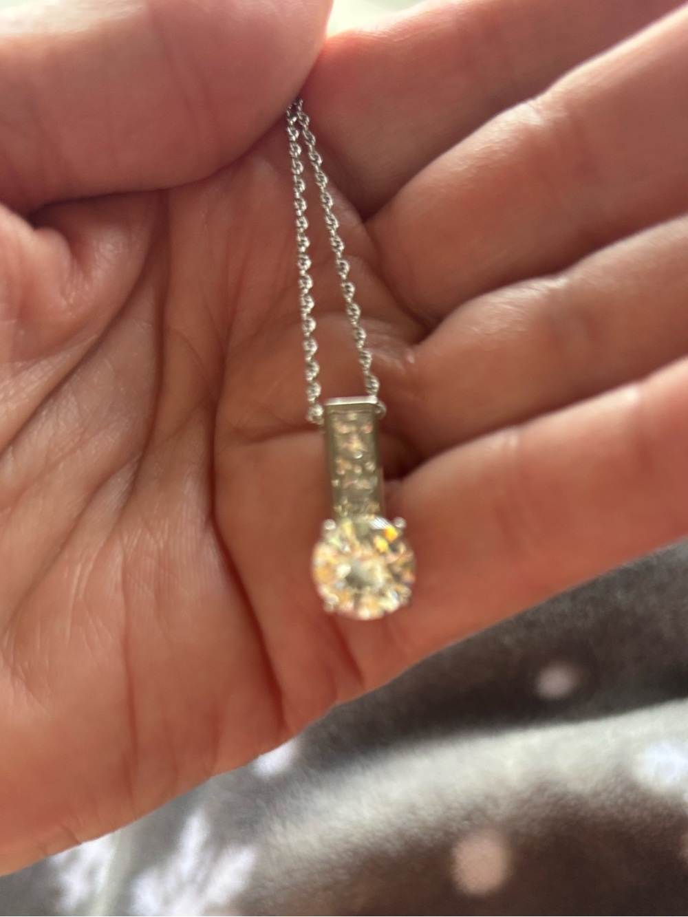Silver Tone Pendant Necklace with Sparkling Round Gem in Silver